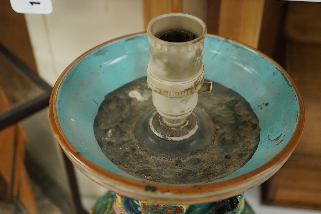 A late 19th century Chinese enamelled porcelain green ground vase with relief decoration, mounted as a lamp, 48cm high overall